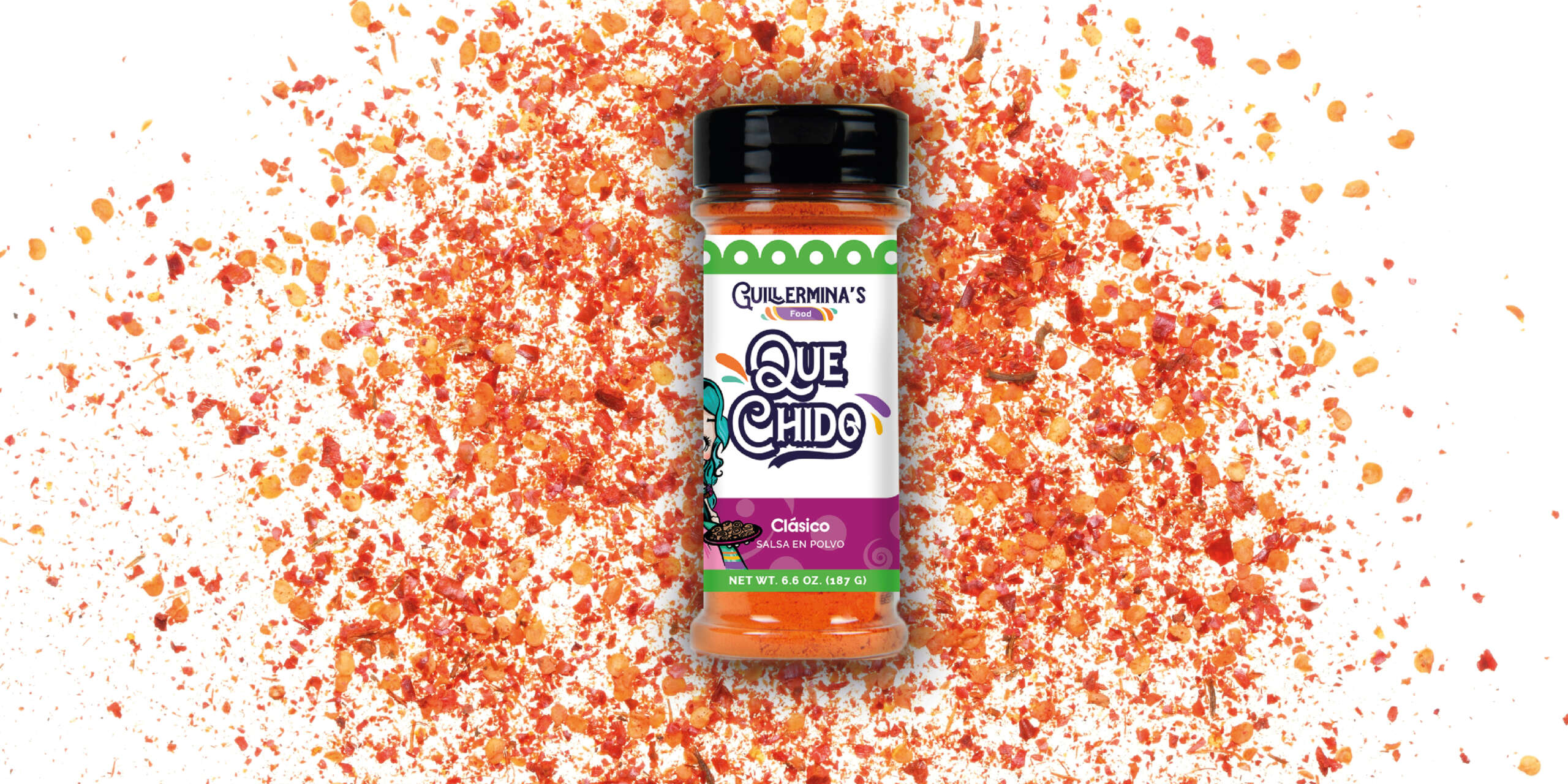 Que Chido seasoning surrounded by chile pieces